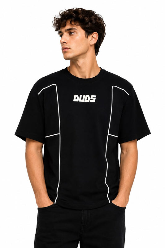 Man wearing a black t-shirt with 'DUOS' logo on a white background