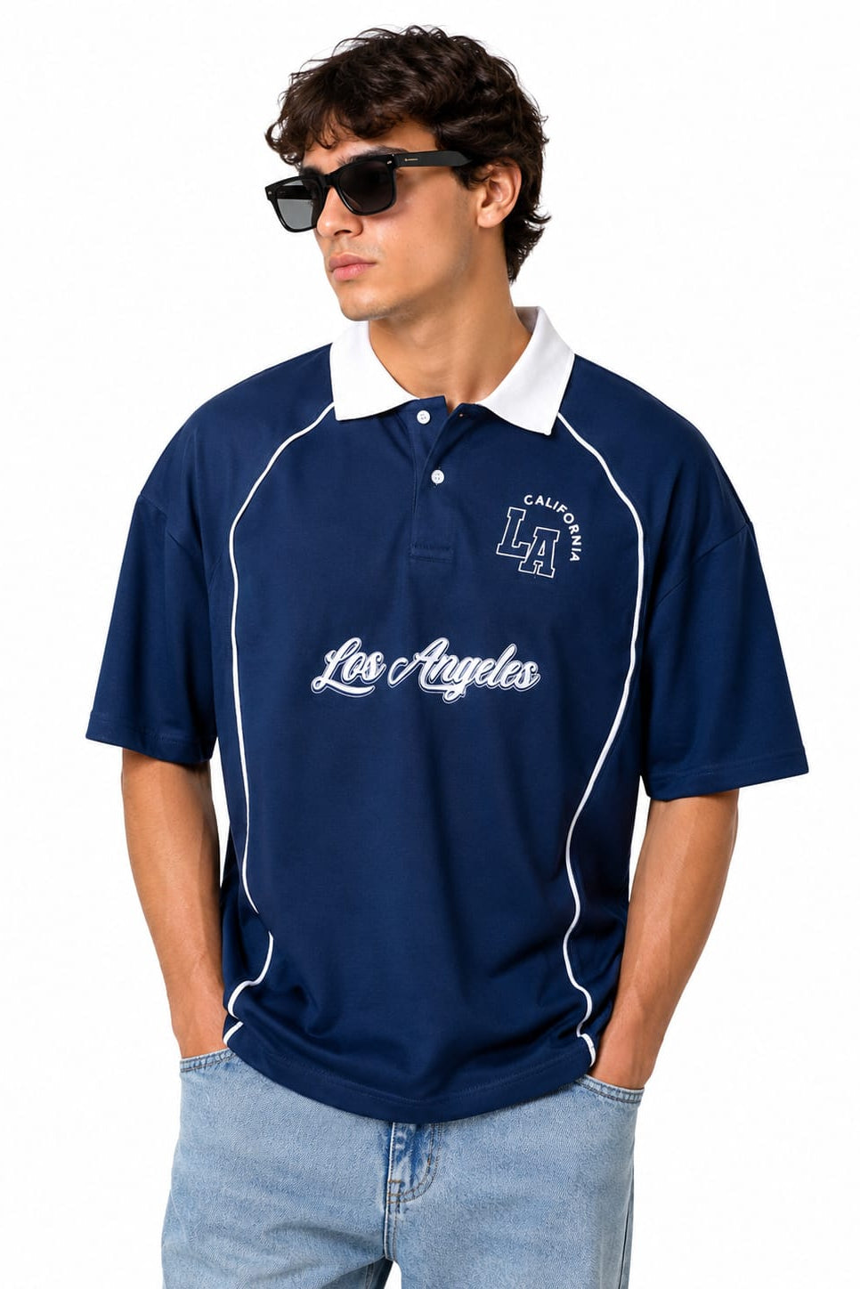 Man wearing a navy blue polo shirt with 'Los Angeles' text and sunglasses on a white background